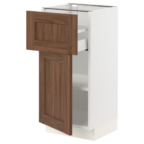 White kitchen cabinet with wooden walnut door open.
