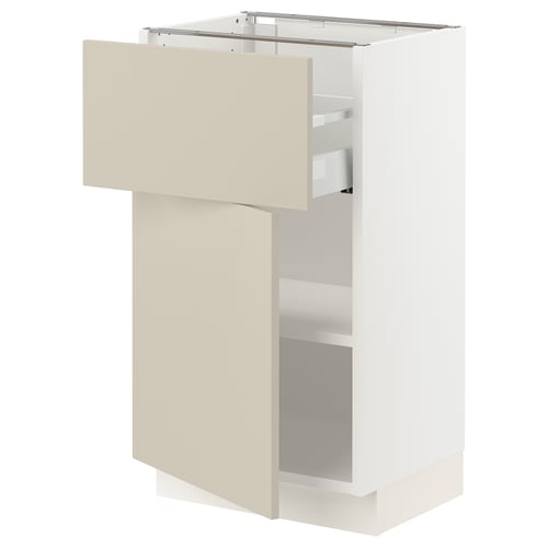 SEKTION white kitchen cabinet in beige with open drawer.