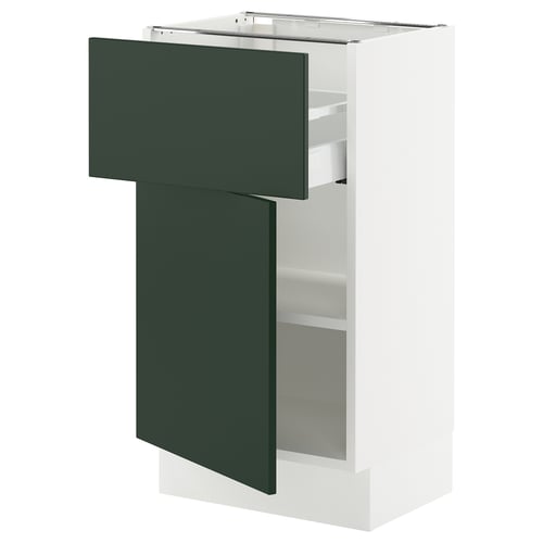 SEKTION kitchen cabinet in white and green with adjustable shelves and drawers.