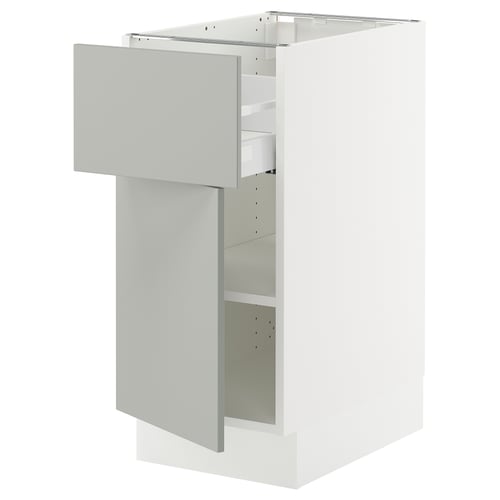 Ikea SEKTION light grey kitchen cabinet with drawer open, modern design.