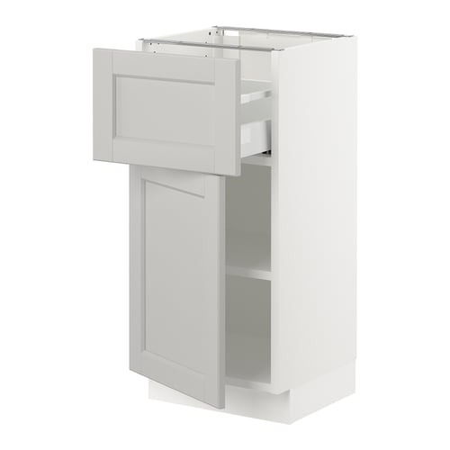 White kitchen cabinet with shelves, drawer, and bevelled edges. Traditional birch wood design with clear lacquer finish.