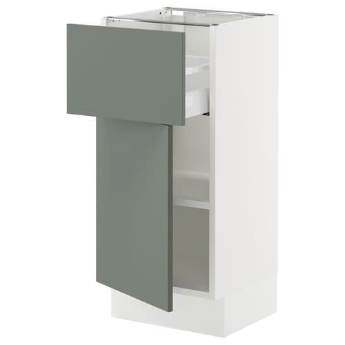 An open, modern kitchen cabinet with a grey-green door and white sides from the SEKTION kitchen system.