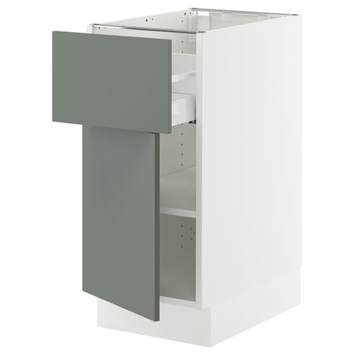 Modern grey-green kitchen cabinet with adjustable shelves and drawer.