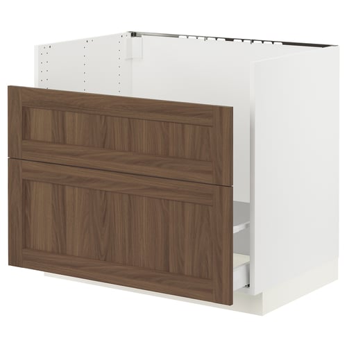 SEKTION kitchen cabinet in walnut brown with white frame and wooden panels.