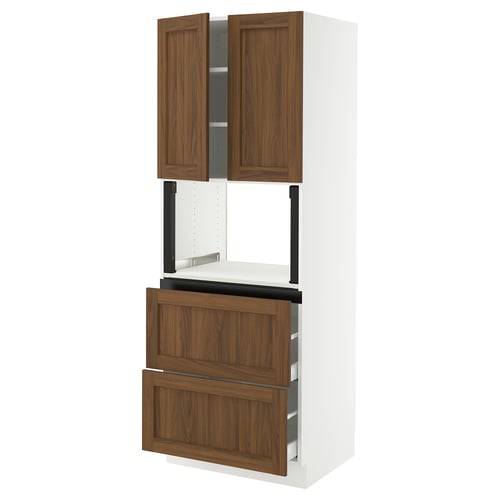 SEKTION kitchen unit with walnut-look drawers and cabinets. Two tall wooden doors above wide drawers, mounted on a white frame.