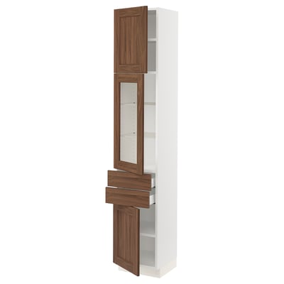 White tall kitchen cabinet with walnut-toned doors and glass panel, featuring drawers and shelves.
