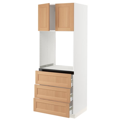 An ikea SEKTION kitchen cabinet with light oak drawers and white frame. It two open cupboards at the top and three wooden drawers below.