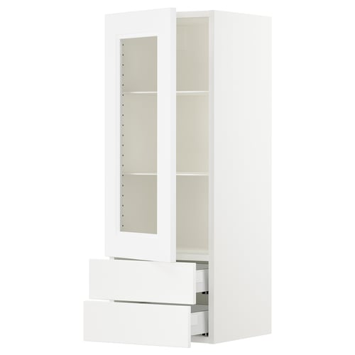 White kitchen cabinet with glass door, adjustable shelves and open drawers. Modern design, made of particleboard, fibreboard and steel.