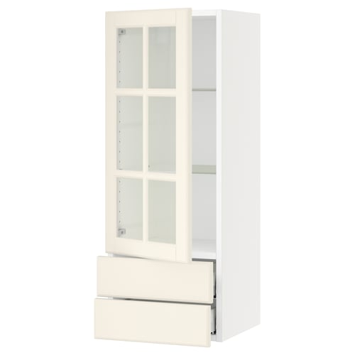 SEKTION off-white kitchen cabinet with glass doors and drawers, featuring bevelled edges and adjustable shelves.