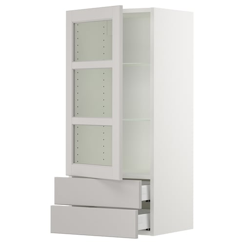 A white SEKTION kitchen cabinet with glass doors and drawers. It has an adjustable shelf and a classic design.