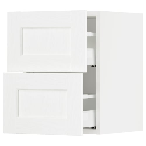 White SEKTION kitchen cabinet with minimalist design, multiple shelves, and smooth drawers.