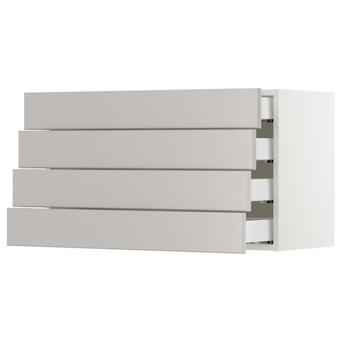 A white SEKTION kitchen cabinet with four drawers, featuring a modern design with bevelled edges.