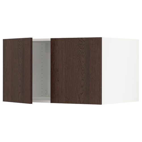 Dark brown wooden cabinet, two open doors reveal metal interior. Modern kitchen design.