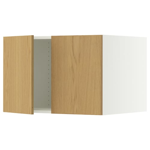 A SEKTION kitchen cabinet in oak veneer with a white frame. It has two adjustable shelves and damper hinges for silent closure.
