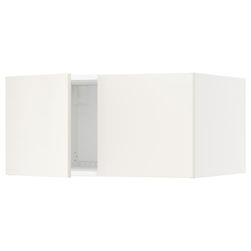 A white SEKTION kitchen cabinet with an open door. The sleek cabinet clean lines and modern minimalist design.