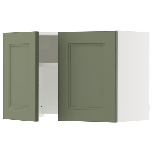 Green SEKTION kitchen cabinet with one open door showing interior.