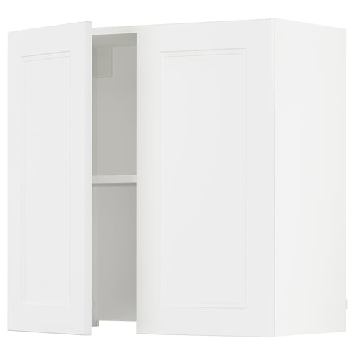 A white SEKTION kitchen cabinet with one door open revealing an adjustable shelf.