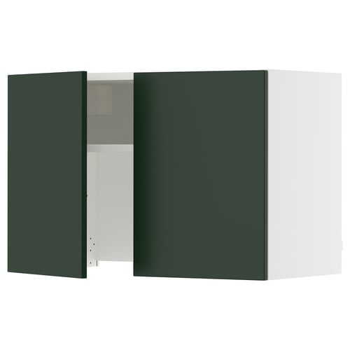 A green SEKTION kitchen cabinet with one door open, revealing shelves inside. The cabinet is rectangular with a sleek design.