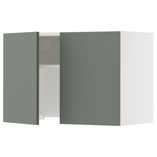 A green-grey ikea SEKTION kitchen cabinet with one door open, revealing inner shelves. The cabinet has a modern design with minimalist edges.