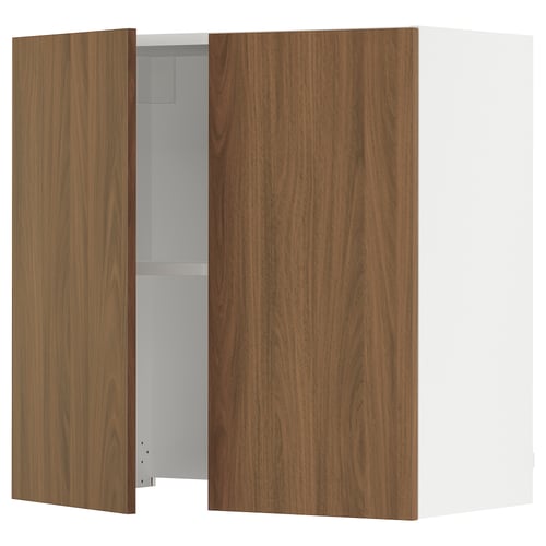 A modern kitchen cabinet with walnut-colored doors and a white frame. It two doors, one open, revealing a single adjustable shelf.