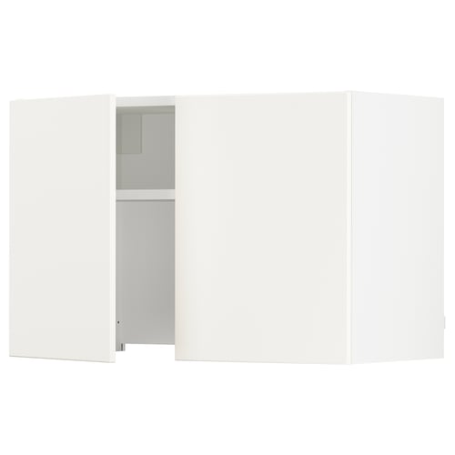 White kitchen cabinet with one open door revealing shelves.