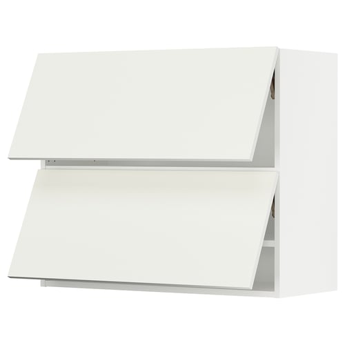 An off-white SEKTION kitchen cabinet with slanted edges, featuring a minimalist design.