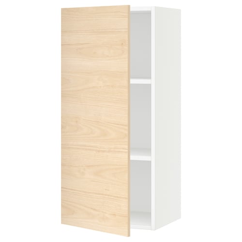A white SEKTION kitchen wall cabinet with a light ash wood door, featuring adjustable shelves.