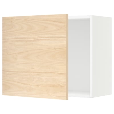 An open light oak-colored kitchen cabinet with a white interior. It a square shape and modern design.