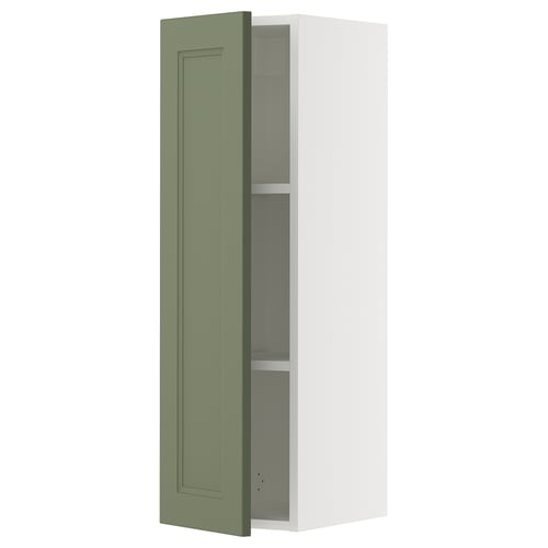 Depicts a tall, narrow white wall cabinet with a singular grey-green door partially open, revealing adjustable shelves inside.