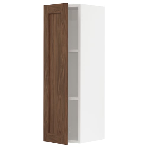 A white SEKTION kitchen wall cabinet with a single dark brown wooden door open, revealing an empty shelf inside.