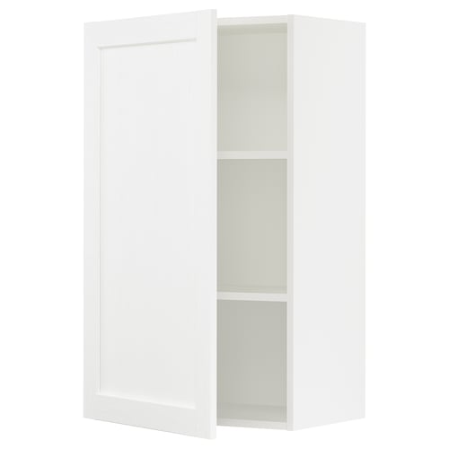 A white SEKTION kitchen cabinet with a door partially open, revealing two shelves inside.