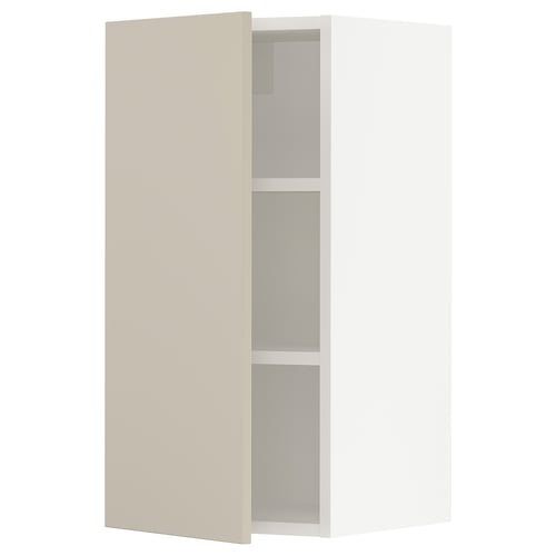Beige SEKTION kitchen cabinet, durable, minimalist with adjustable shelves and smooth hinged doors.
