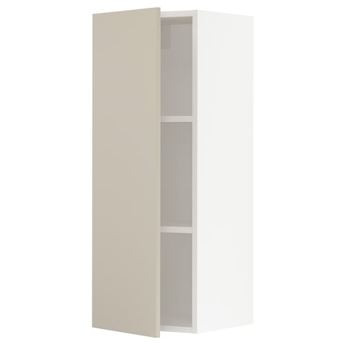 A beige SEKTION kitchen cabinet with an open door, revealing an adjustable shelf inside. The cabinet is rectangular and a smooth, clean design.