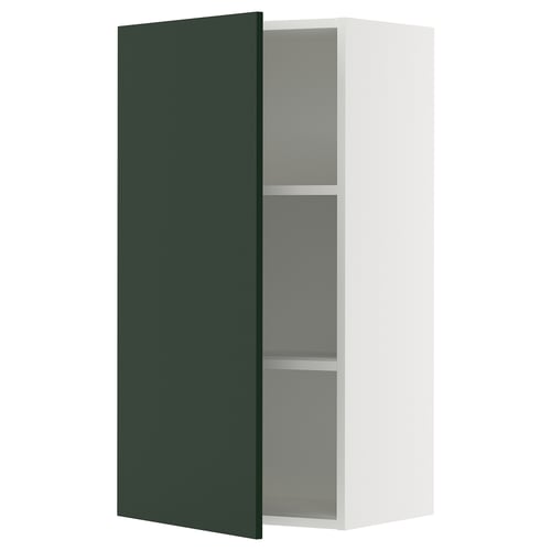 An ikea SEKTION kitchen cabinet with a green havstorp door, white frame, and adjustable shelves.