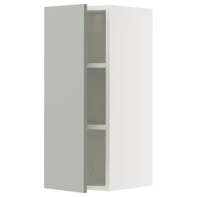 White SEKTION wall cabinet with grey glass shelf.