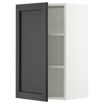 Displays a black stained wooden cabinet door with bevelled edges from IKEAs SEKTION kitchen system.