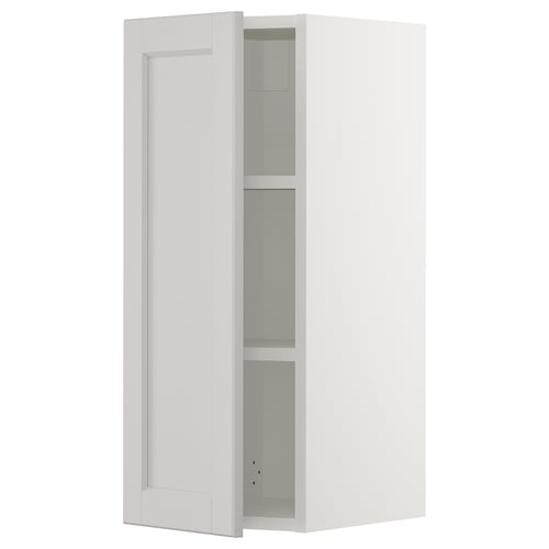 White SEKTION kitchen cabinet with adjustable shelves and bevelled edges.