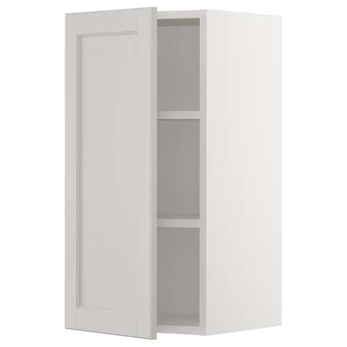 An open white ikea SEKTION wall cabinet with a single adjustable shelf. It a clean, classic design with a smooth, flat panel door.