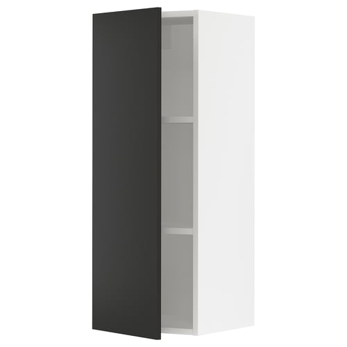 A white, tall, narrow kitchen cabinet with a single black door and two shelves inside. The door swings open to the right.