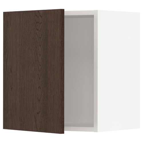 Dark wood kitchen cabinet door with white interior.