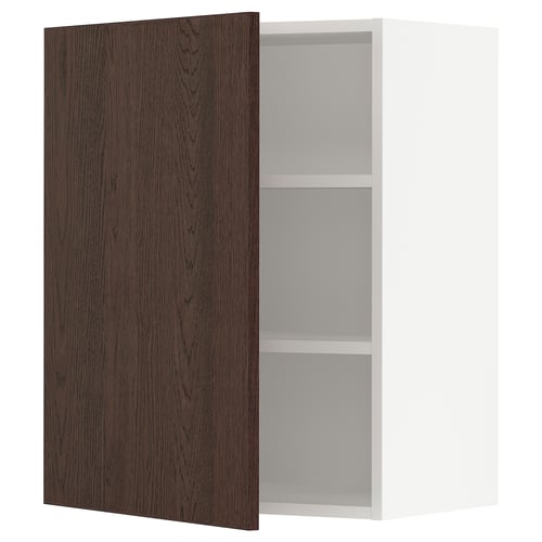 Wooden brown cabinet door open revealing white shelves on white base.