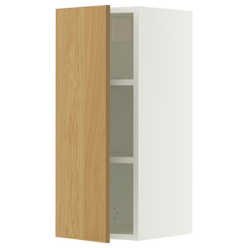 A white SEKTION wall cabinet with a light oak door, featuring an adjustable shelf inside.
