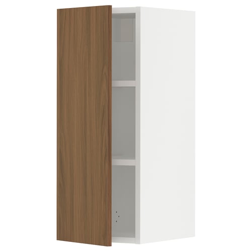 An open SEKTION kitchen cabinet with a wooden front door and white sides. It a modern walnut look with an adjustable shelf inside a sturdy frame.