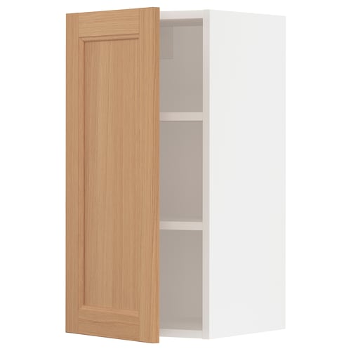 A SEKTION kitchen cabinet with a natural oak door, adjustable shelves, and a door damper. The cabinet is white and has a sleek, modern design.