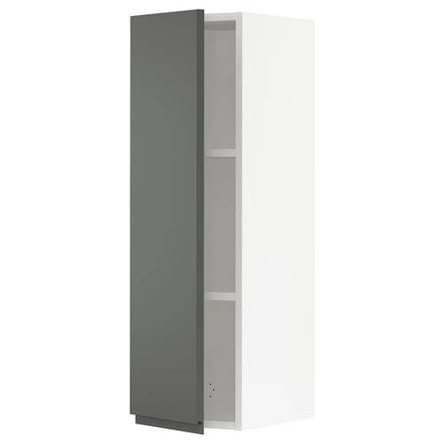 A modern grey kitchen cabinet with an adjustable shelf and slow-closing hinges.