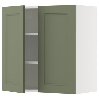 Green kitchen cabinet, SEKTION brand, wall-mounted with two doors, one open revealing shelves. Simple, modern design.