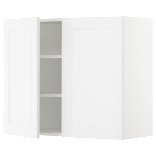 A white SEKTION kitchen wall cabinet with one open door revealing three shelves.