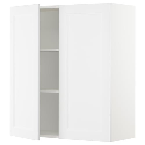 White SEKTION kitchen cabinet with one open door, adjustable shelves, and a sleek design.