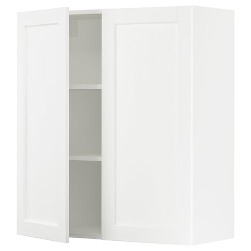 White wall cabinet from SEKTION with one open door revealing shelves.