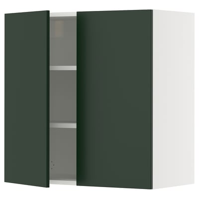 Green wall-mounted kitchen cabinet with one door open.